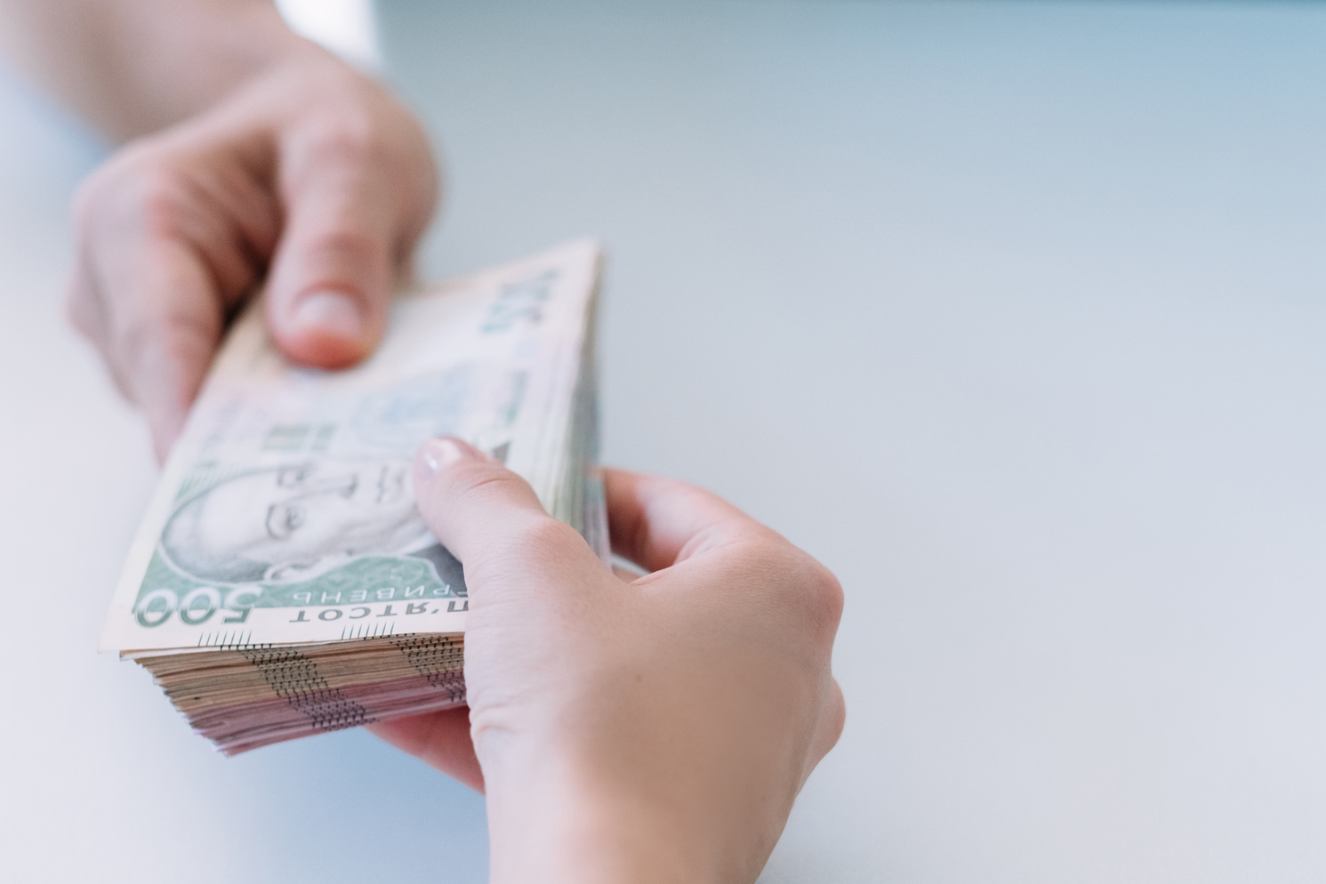 hands bundle money cash payment bribery hryvnia